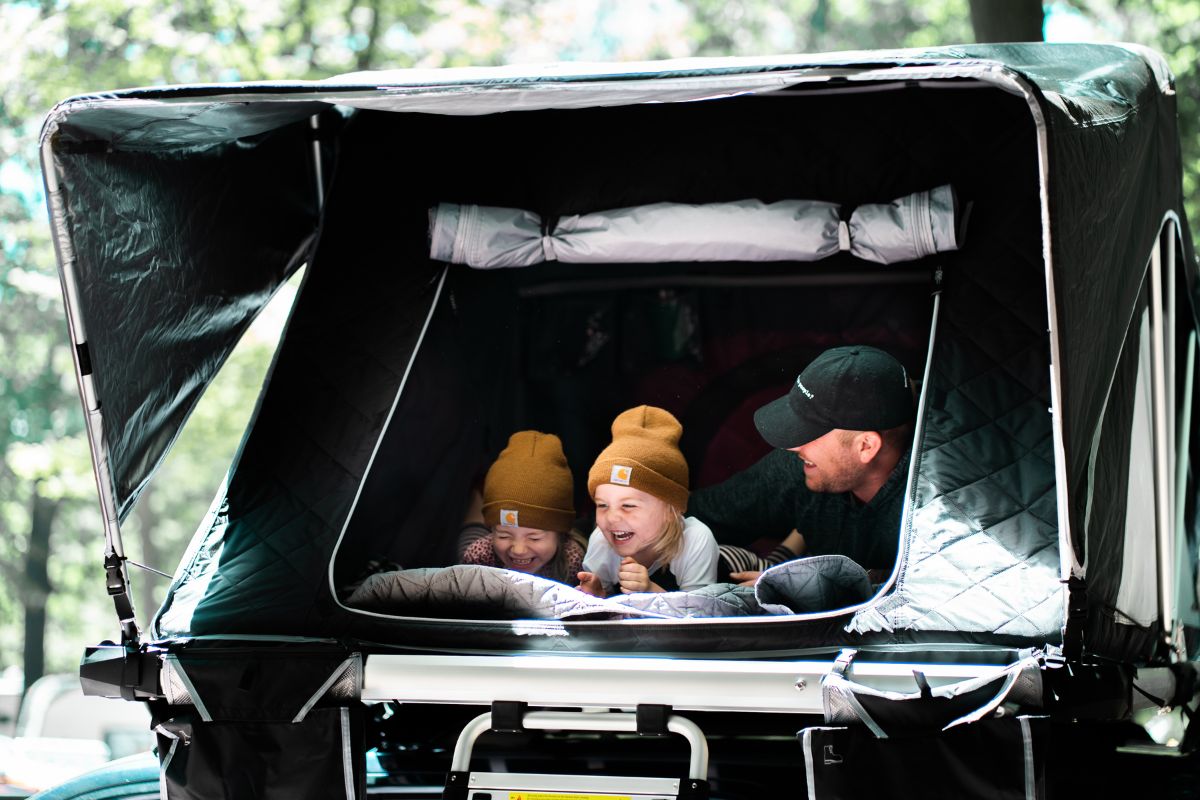 a family in a camper, one of the many types of camping