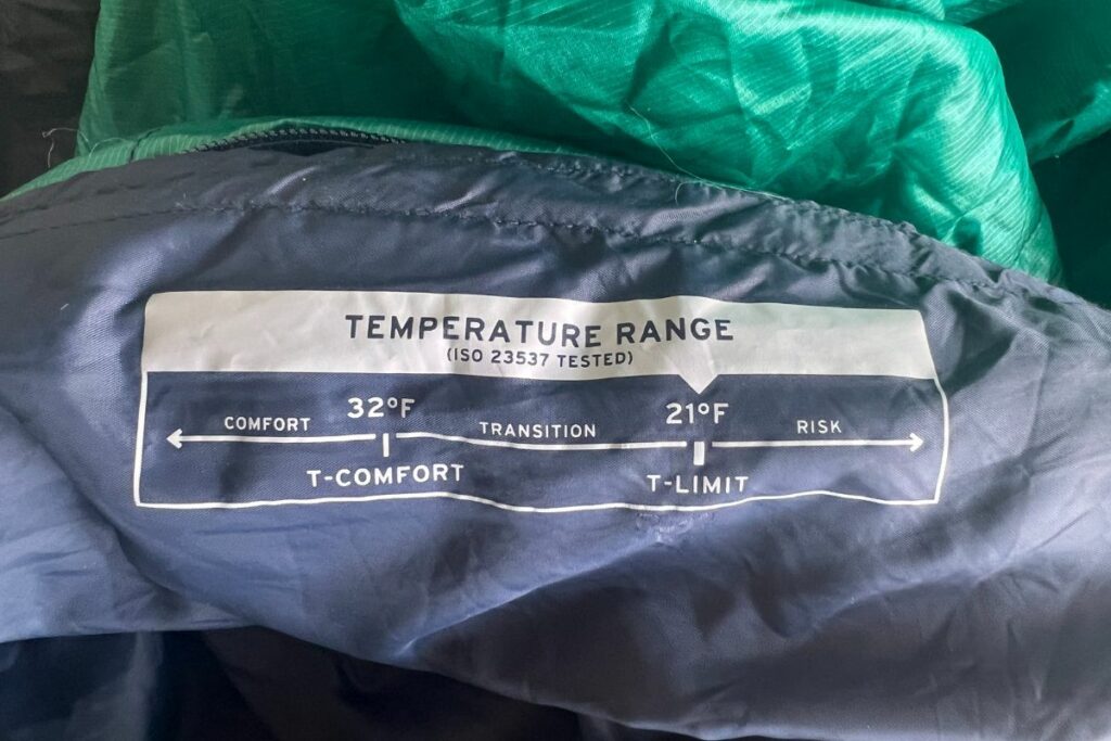 temperature rating information label on a camping sleeping bag from REI